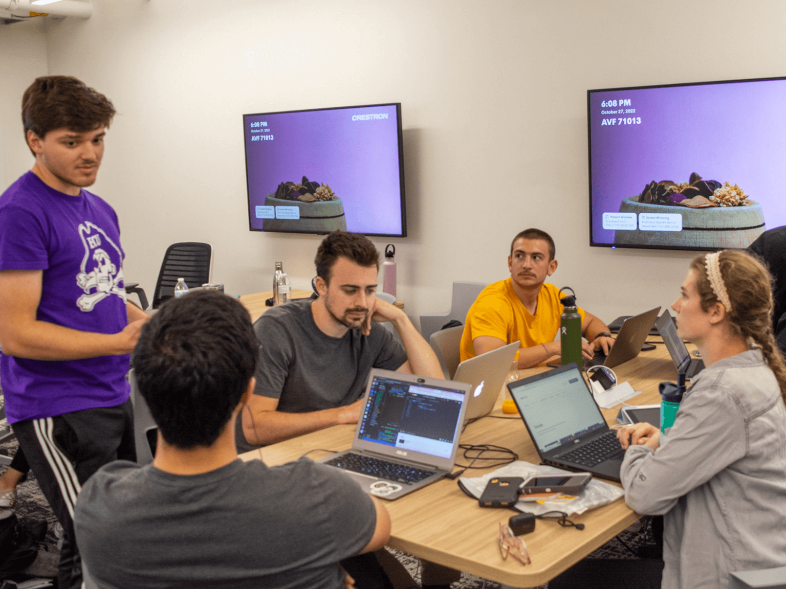 Students working at Manage-A-Hack
